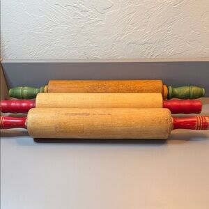 Three Vintage Wooden Rolling Pins with Red and Green Handles.